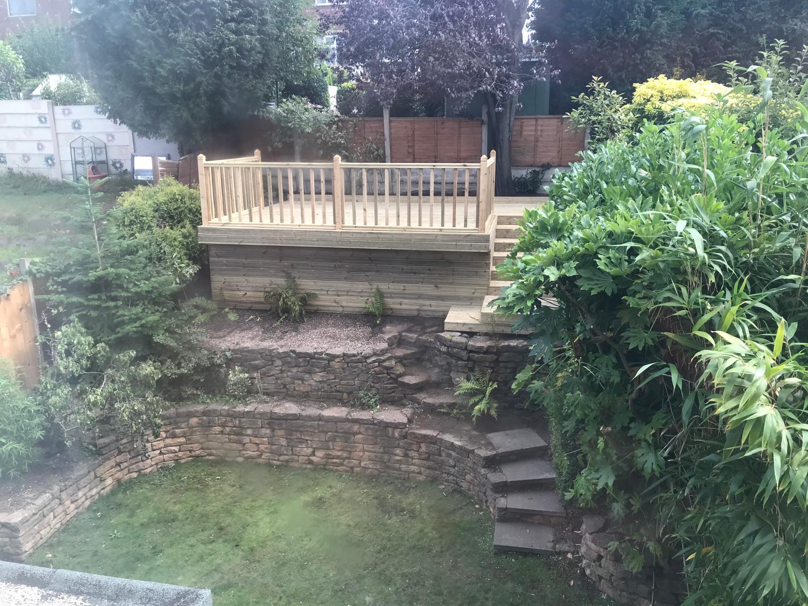 Terraced garden after — completed raised deck with stone terracing