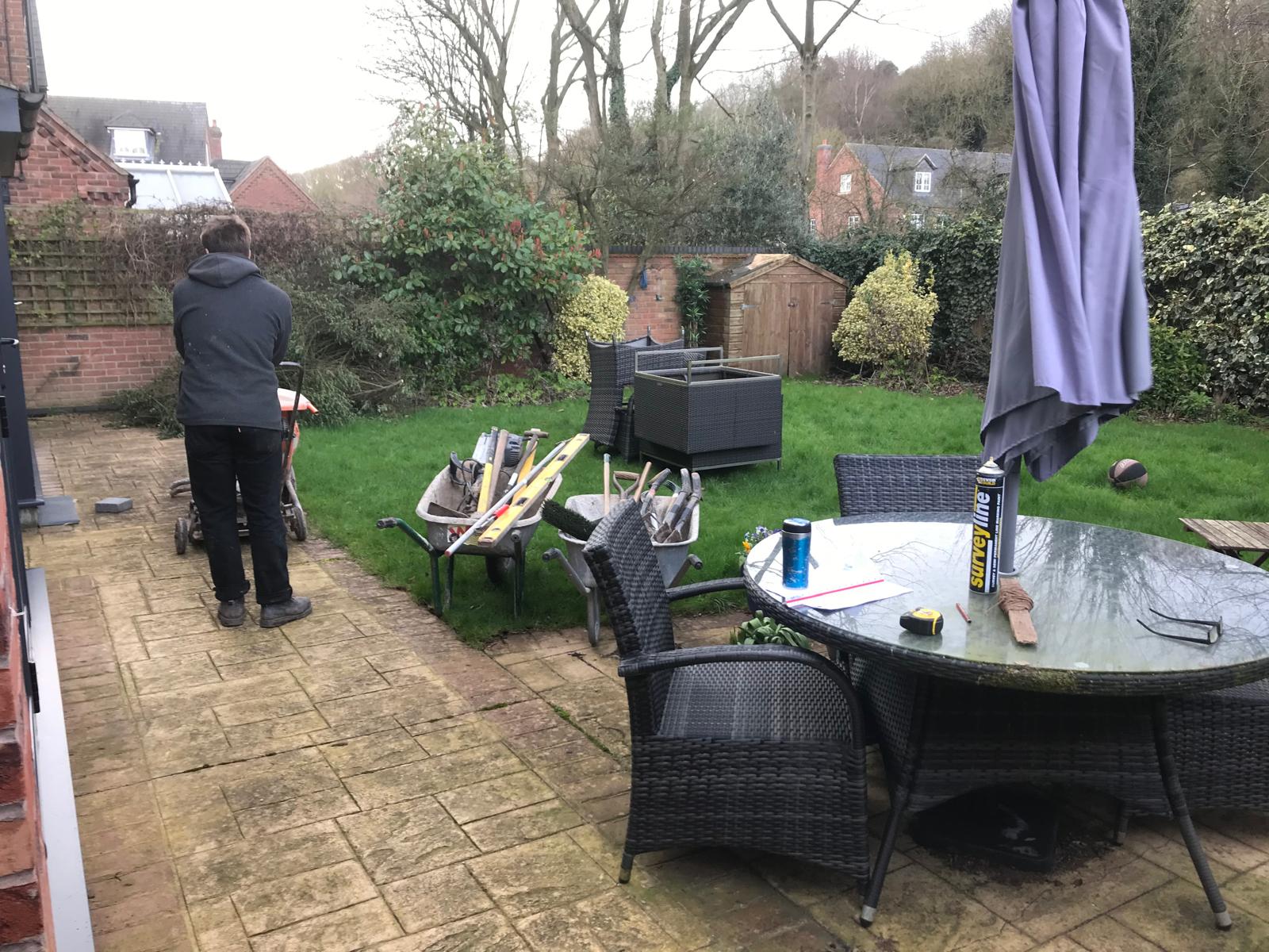 Garden before overhaul — worn paving and tired layout