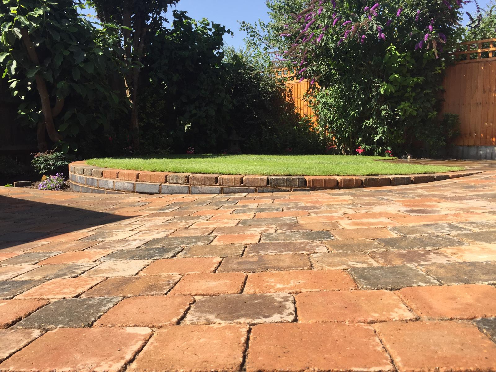 Stone sculpture and paved garden terrace
