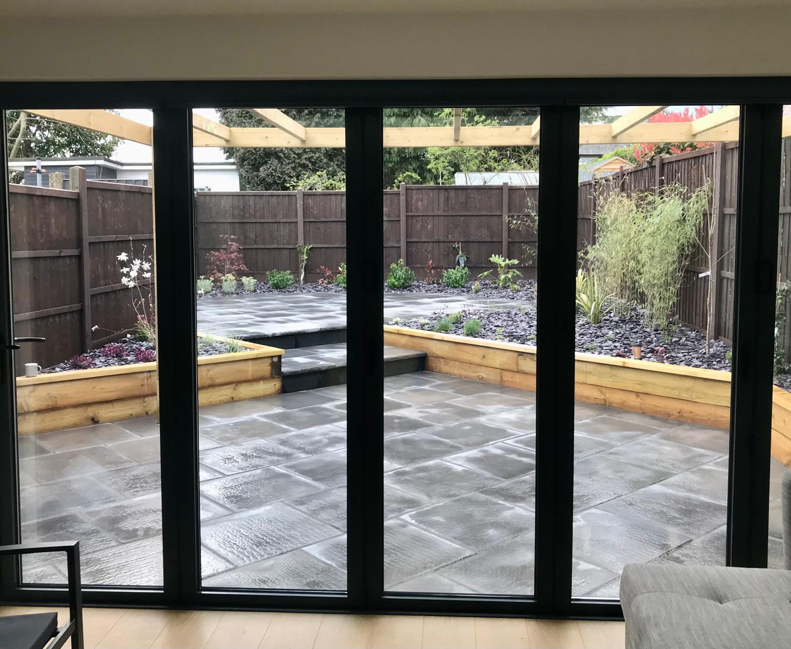 Patio with pergola and raised beds