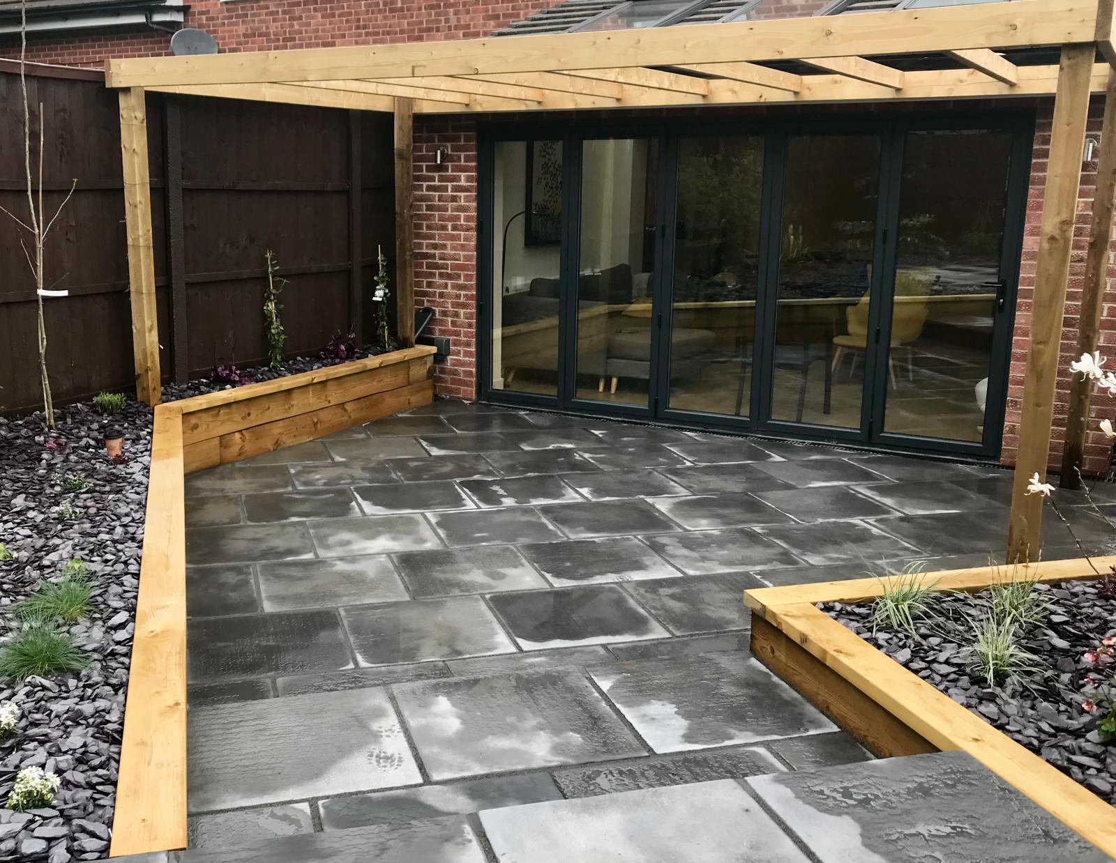 Indian stone patio with oak pergola — Tall Trees Landscapes